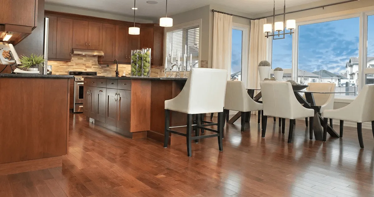 A modern kitchen with professionally installed wood flooring in Peoria, IL
