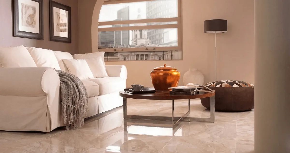 Modern living room with professionally installed marble flooring, a beige sofa, coffee table in Peoria, IL
